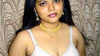 Gorgeous Neha Nair in white bra giving seductive poses and playing with bigtits